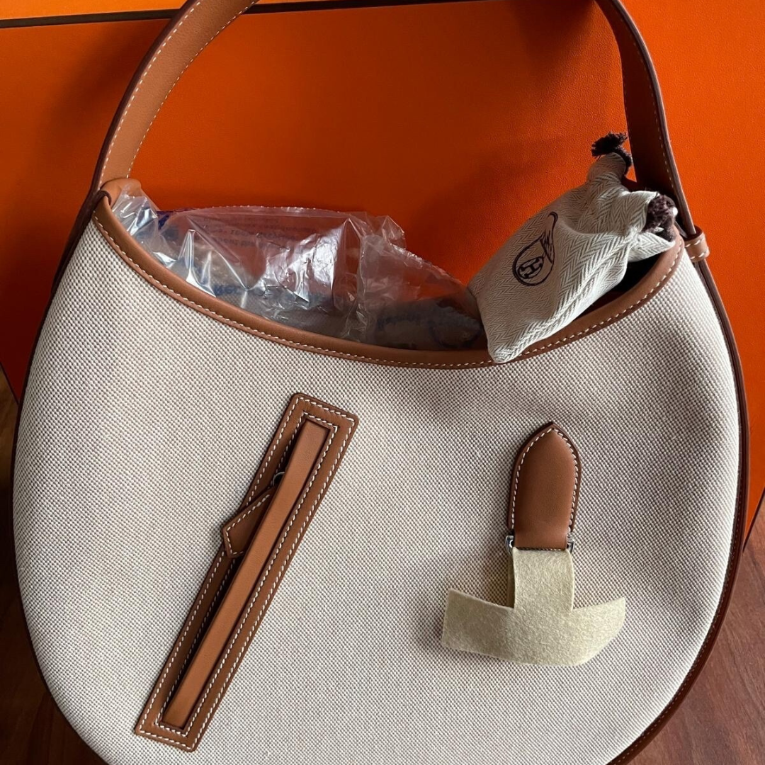 SMALL SADDLE BAG MADE OF FABRIC AND LEATHER FROM HERMÈS